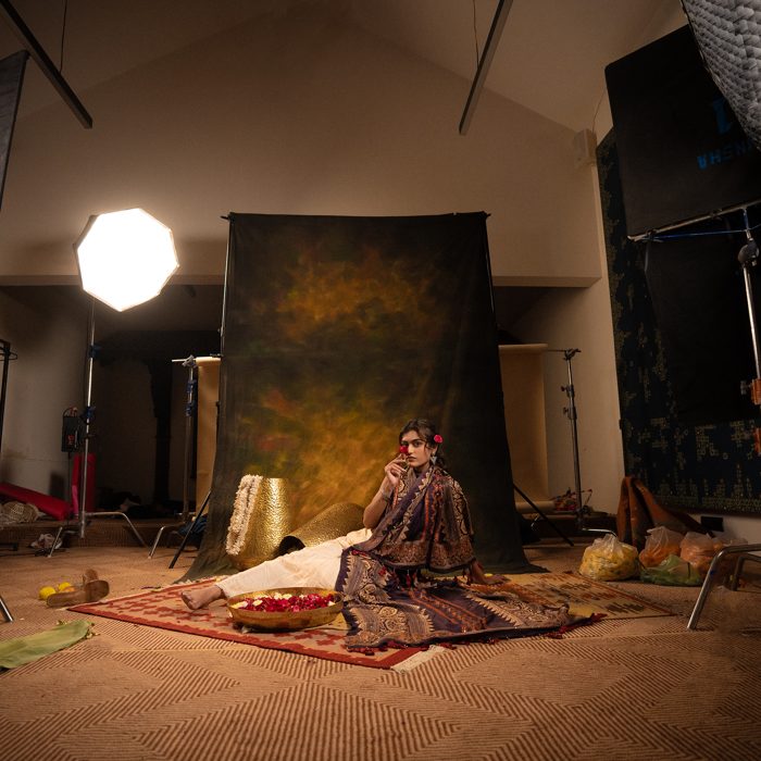 Dhaval Vanol on set — a lit studio floor during a fashion shoot
