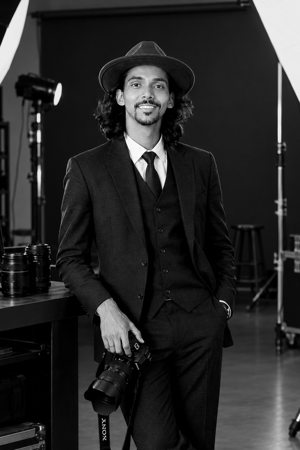 Portrait of Dhaval Vanol in the studio with his camera